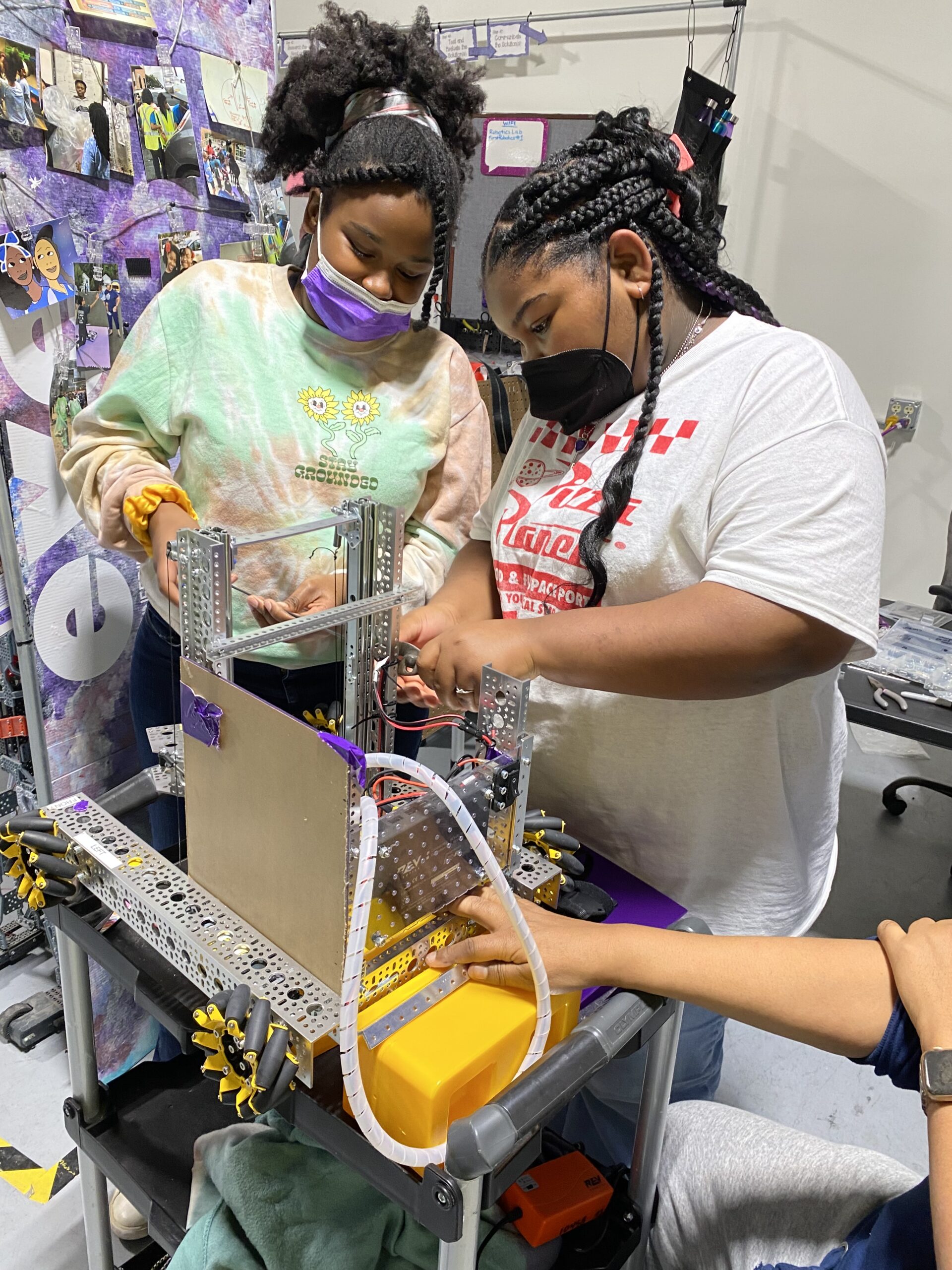 Children building a robot
