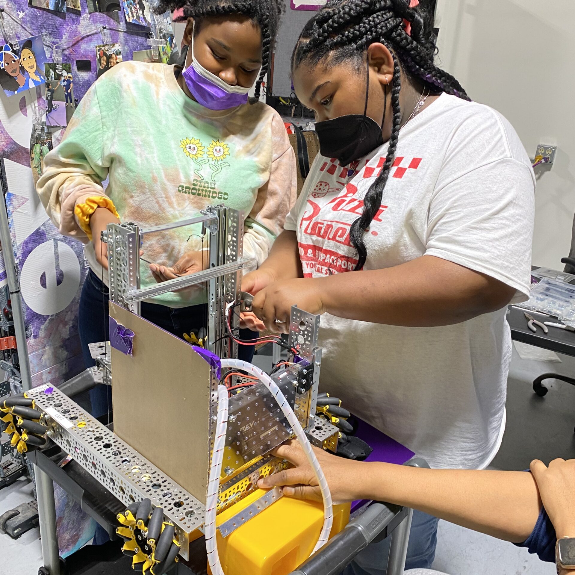 Children building a robot